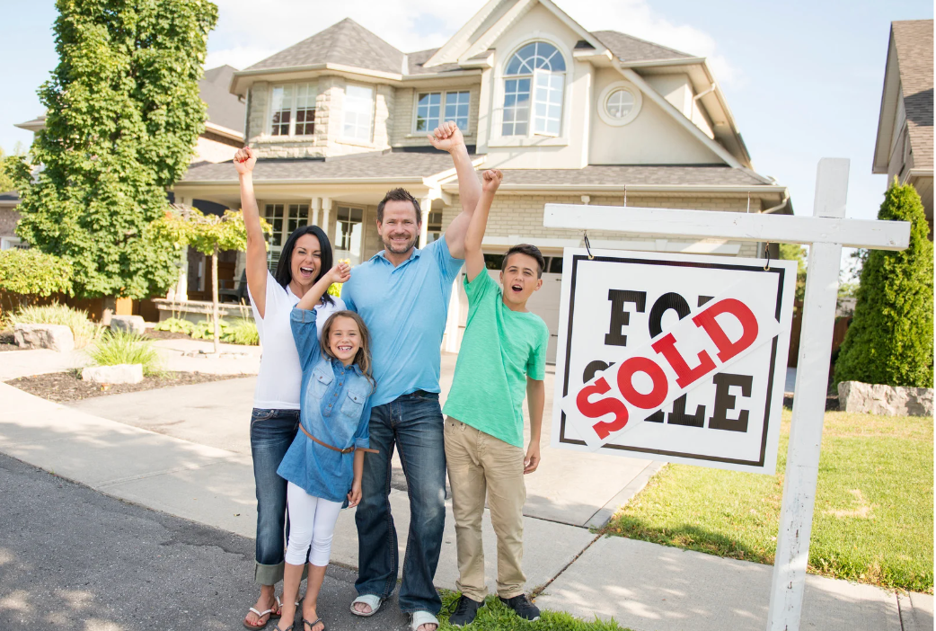Home buyers after closing at their new house