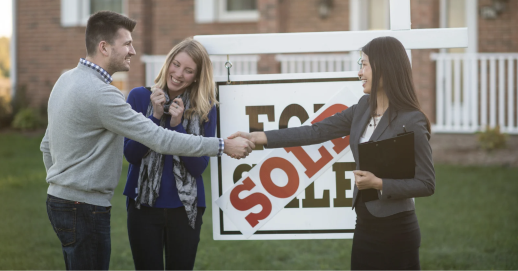 Home sellers celebrating getting their home sold with their agent