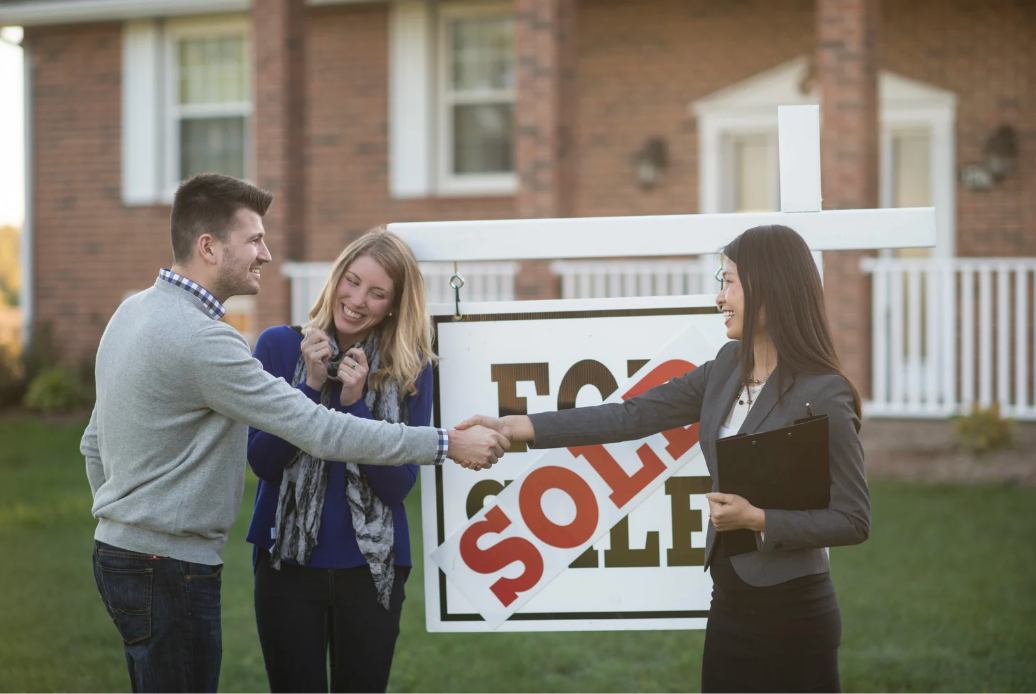 Home sellers celebrating getting their home sold with their agent