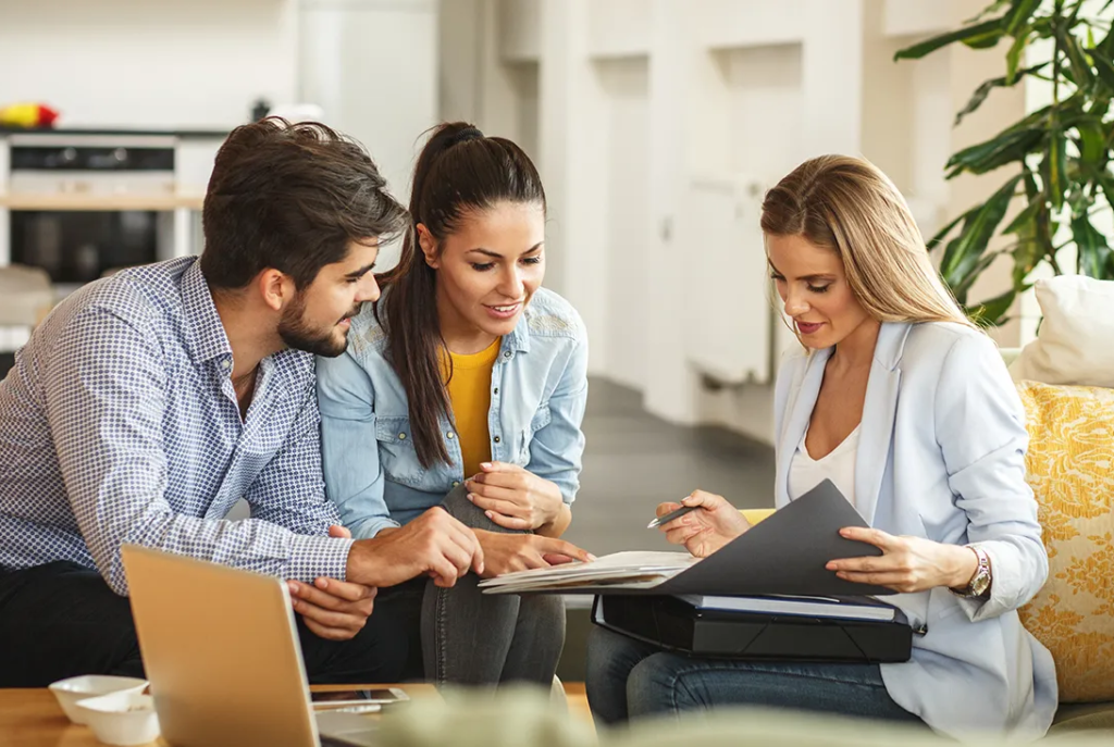 Home buyers with their agent
