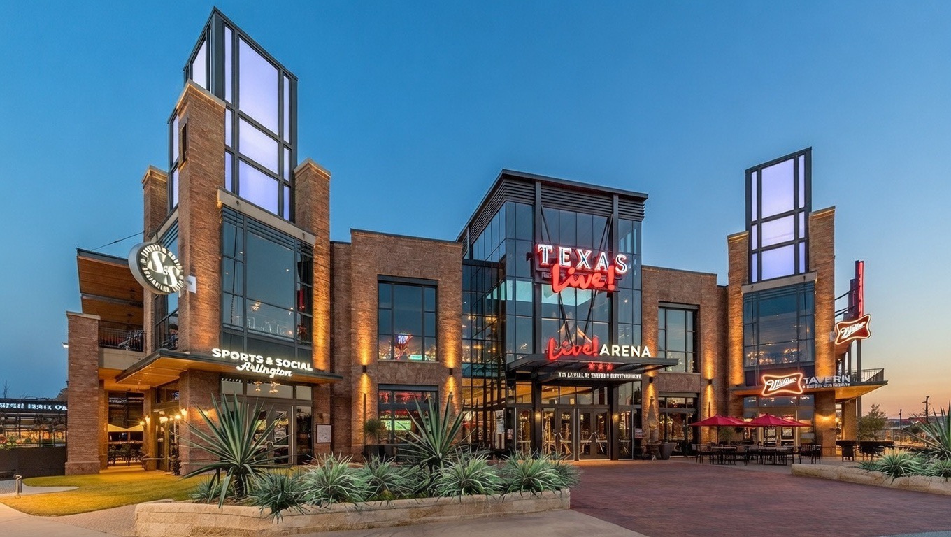 One Rangers Way sits at the geographic heart of the Arlington Entertainment District, which occupies roughly 100 acres between I-30, Highway 360, and Randol Mill Road. The address 1200 Nolan Ryan Expressway, places residents within a short walk of some of North Texas's most iconic venues